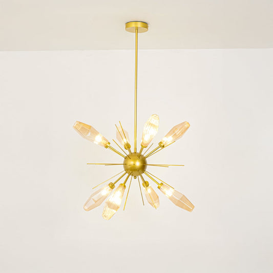 Amber glass and golden metal chandelier glowing beautifully against white background adding modern elegance to home decor.