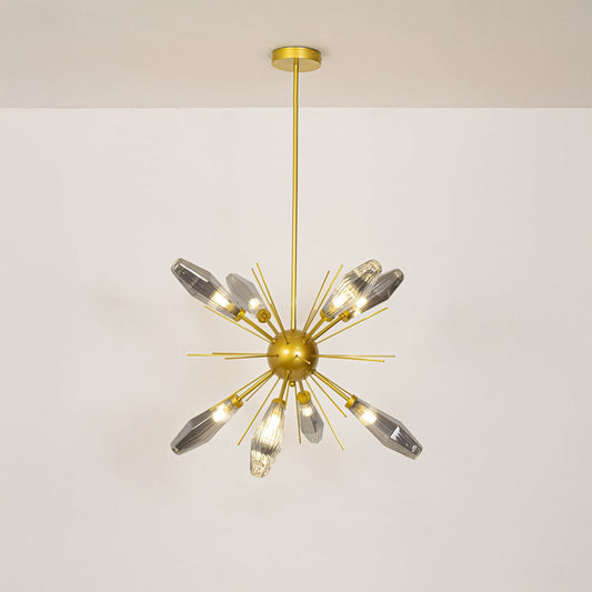 Modern gold chandelier with crystal glass rods styled in a luxurious living room adding elegance and ambient glow to interiors.